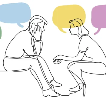Stock image of two people talking with speech bubbles floating around them