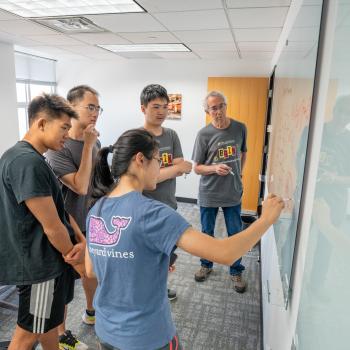 Solving math problems at the whiteboard