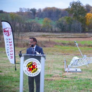 Sumant Nigam standing at podium for inauguration of the first Maryland Mesonet tower