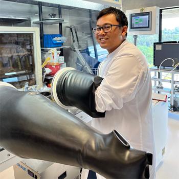 Garmani Thein pictured working with a glove box in the lab