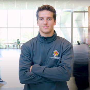 Hayden Earlewine wearing a gray CMNS quarter zip