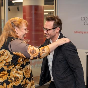 Jan Plane with her hand on Brendan Iribe's shoulder