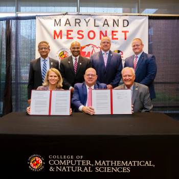 UMD and State of Maryland leaders pose with the agreement for the Maryland Mesonet