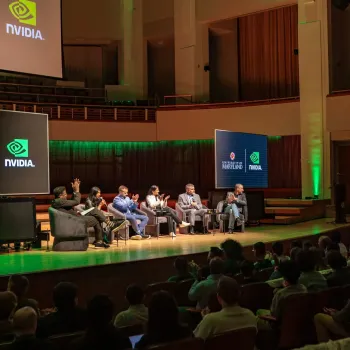 six panelists sit on stage
