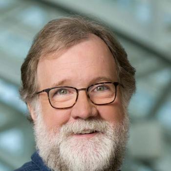 Evolutionary Biologist Sean B. Carroll, bearded with glasses.