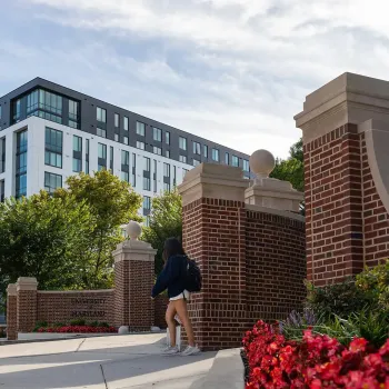 Route one entrance to campus with apartments in the background