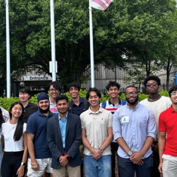A group of University of Maryland students standing outside a building.