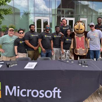 Microsoft team posing with Testudo in front of the Iribe Center in May 2025