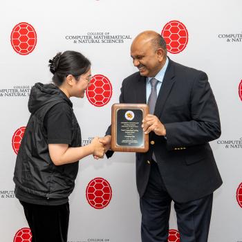 Dean Varshney presenting TA award to Mengting Chao