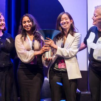  From left, actress Maisie Williams, Korion Health co-founders Akshaya Anand ’19, M.P.S. ’23 and Anna Li, and Hult Prize CEO Lori van Dam share the stage as the startup was named the $1 million winner at the London finals in early September.  Photos courtesy of the Hult Prize Foundation