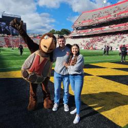 Testudo posing with Hallie Pennington and Collin Vincent after they got engaged at SECU Stadium