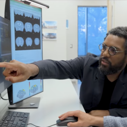 Nik Francis pointing at a computer screen