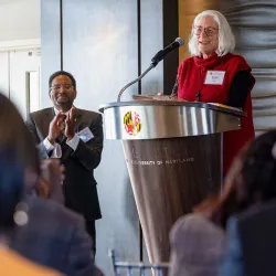 Anne Simon, professor of cell biology and molecular genetics, speaks to university colleagues after accepting the inaugural President’s Impact Award on Thursday from UMD President Darryll J. Pines, shown at left. 