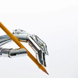 Robot hand holding a pencil