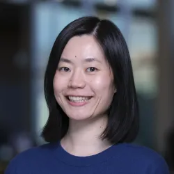 A woman, Dr. Yizheng Chen, smiling.