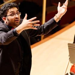 Conductor conducting on stage. Credit: Ken Rubin