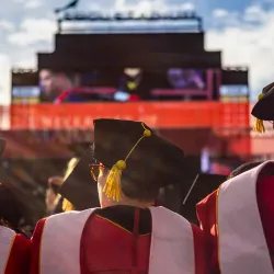 Image of UMD students at graduation in caps and gowns