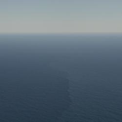 Aerial view of open ocean with a faint vertical streak marking a surface front amid calm blue water.