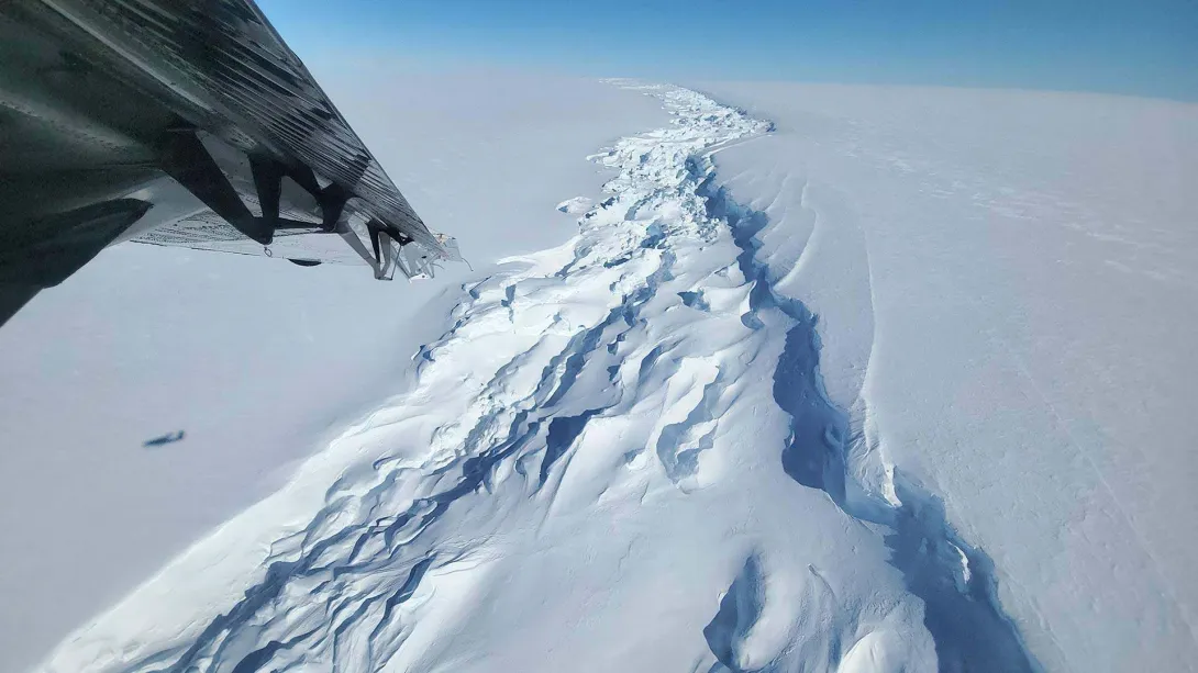 The rift on the Ross Ice Shelf as seen from a plane. A trio of geology researchers braved wind, snow and wind chills in the single digits to collect valuable data in Antarctica.