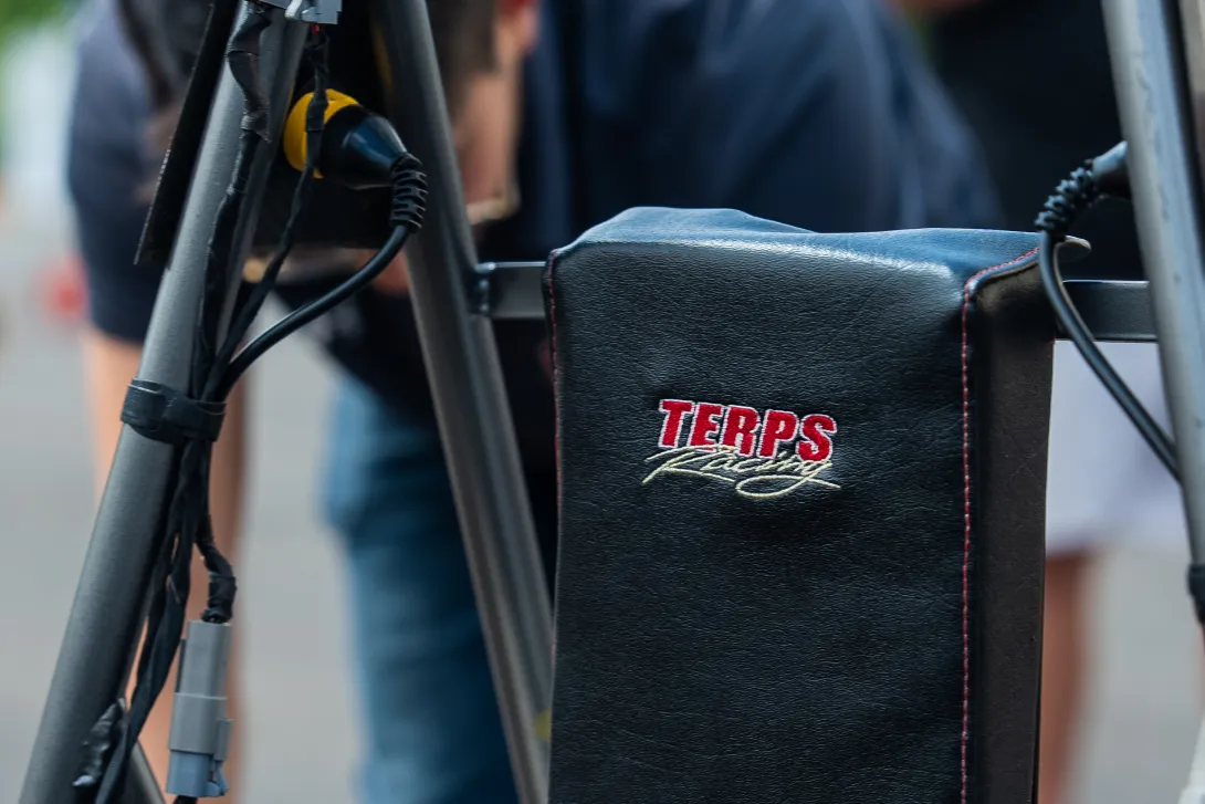 Close-up of the headrest of the car, which has the team's logo embroidered in it.