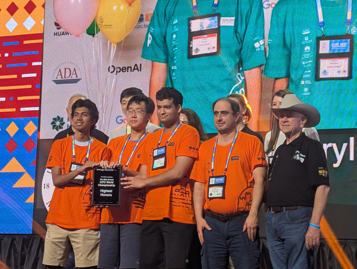 photo of University of Maryland students Sujay Konda, left, Kelin Zhu, second from left, and Danny Mittal, center, stand with Professor Mohammad Hajiaghayi, second from right, after receiving Highest Honors at the ICPC World Finals in Baku, Azerbaijan, on Wednesday, Sept. 4, 2025.