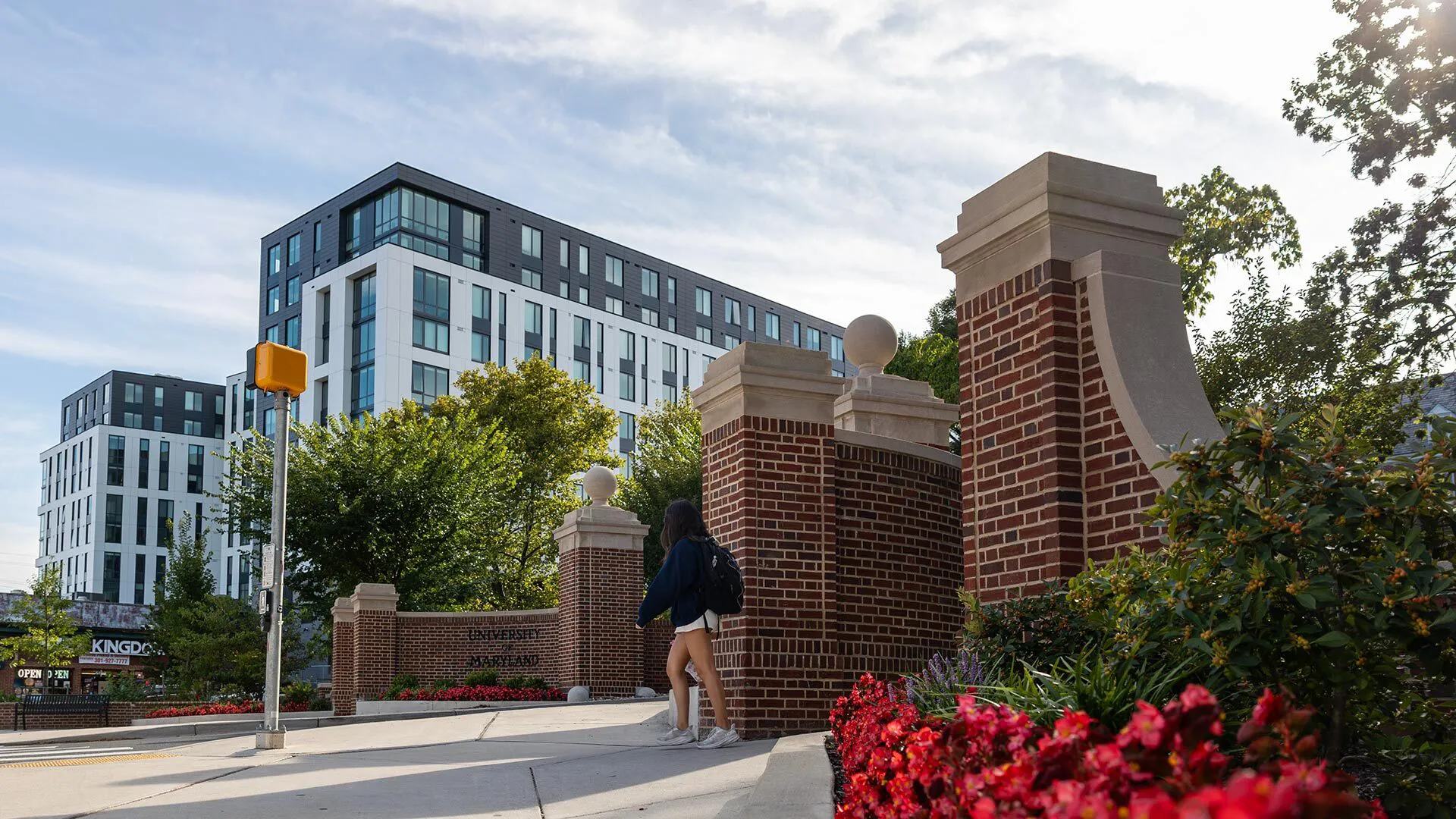 Route one entrance to campus with apartments in the background